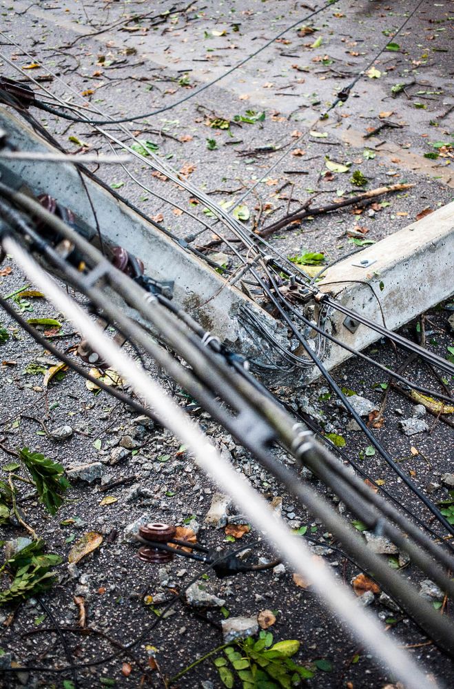 Telephone pole damaged by bad weather.