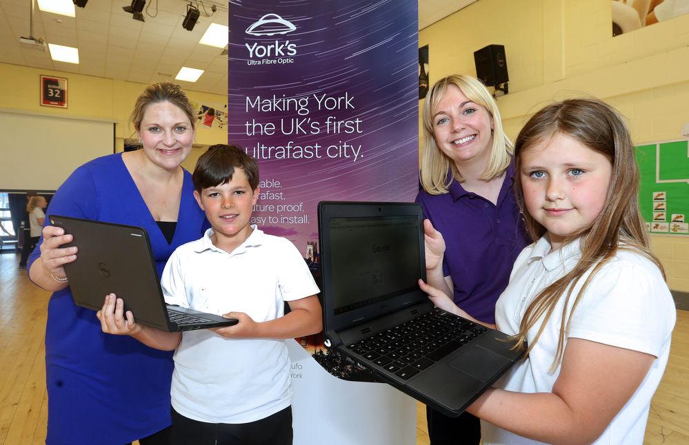 Helen Fletcher, Marketing Manager of York's Ultra Fibre Optic (right) with Head Teacher, Alex Winter, Alfie Edwards and Jodie Wood at Hob Moor Community Primary Academy.jpg