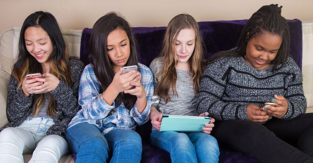 Young girls on mobiles.jpg