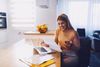 woman-paying-bill_304974955.jpeg