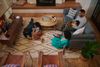 Family together using different devices and TV on