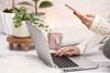 Lady using laptop and mobile phone