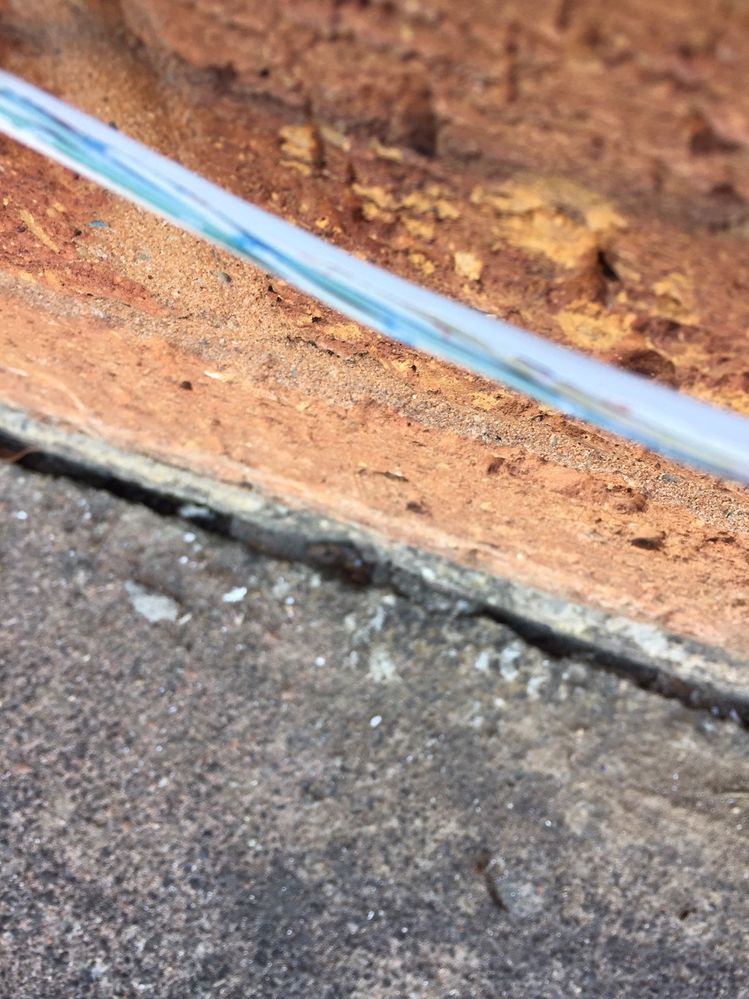Split in insulation with wires exposed.