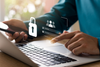 person-with-laptop-and-mobile-with-username-&-password-graphic